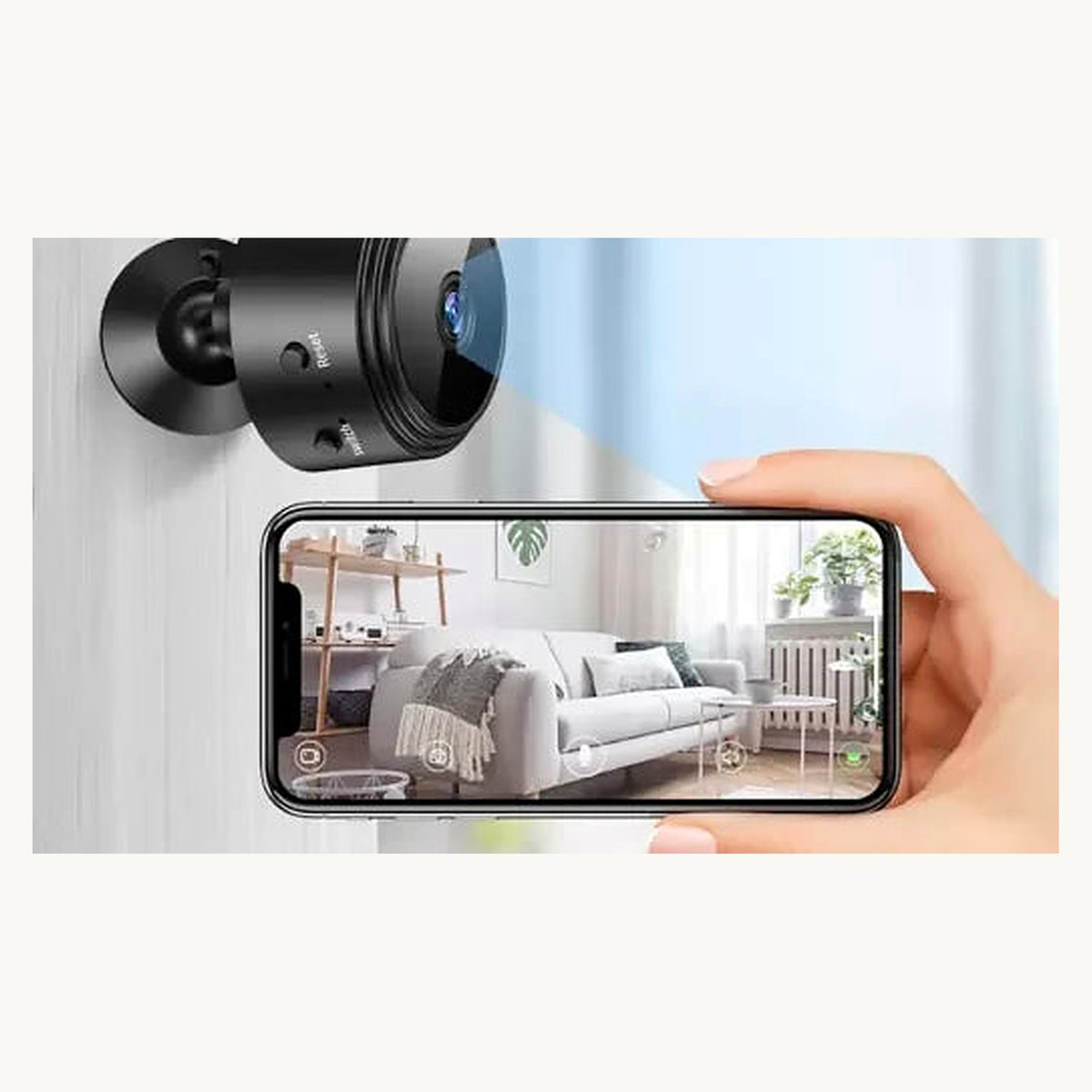 A9 mini camera on wall with remote view on phone