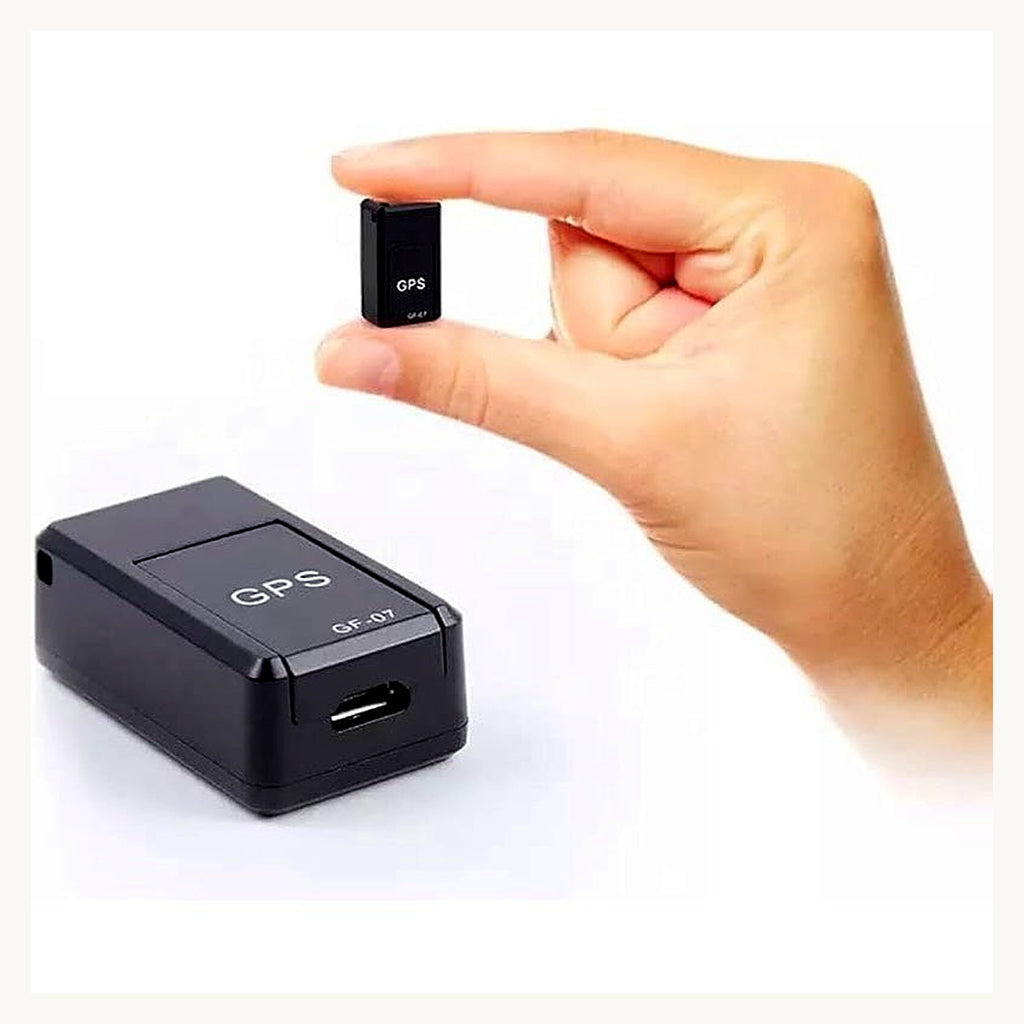 Mini GPS tracker held between fingers, shown next to device
