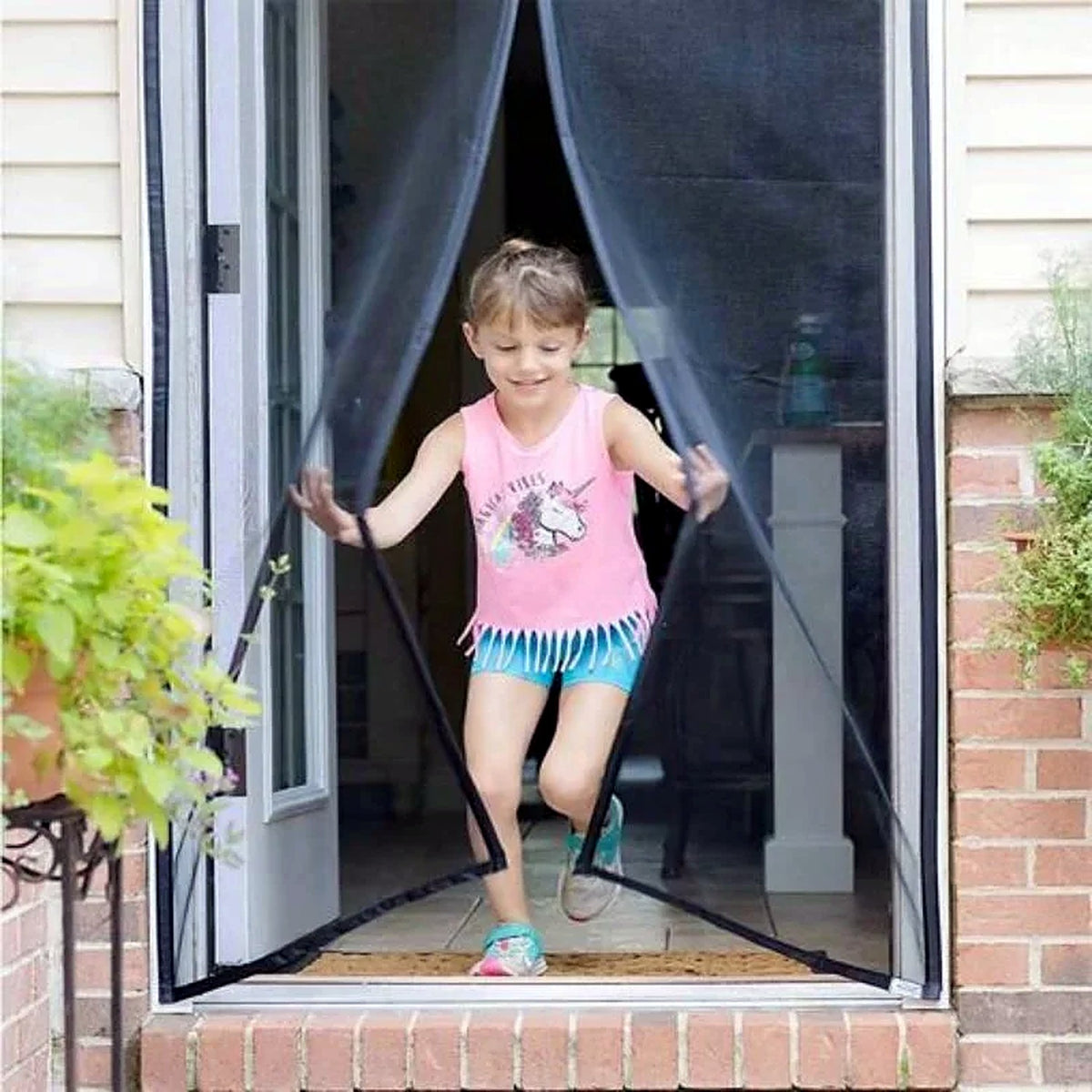 Hands-free magnetic mosquito door net in use